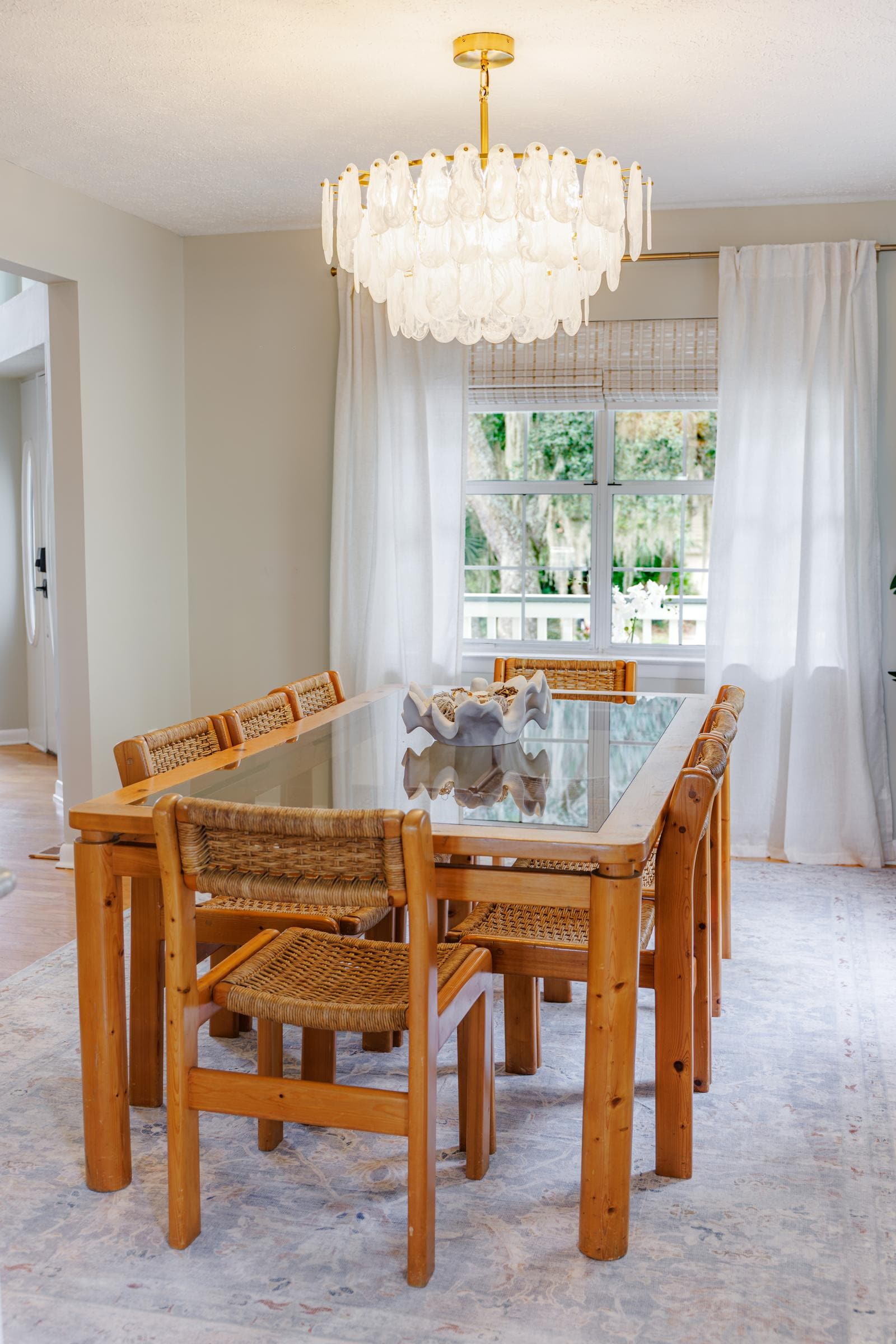 Dining room with glass-top table seating 8