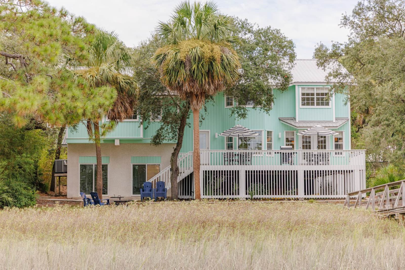 Rear of the home across the marsh field