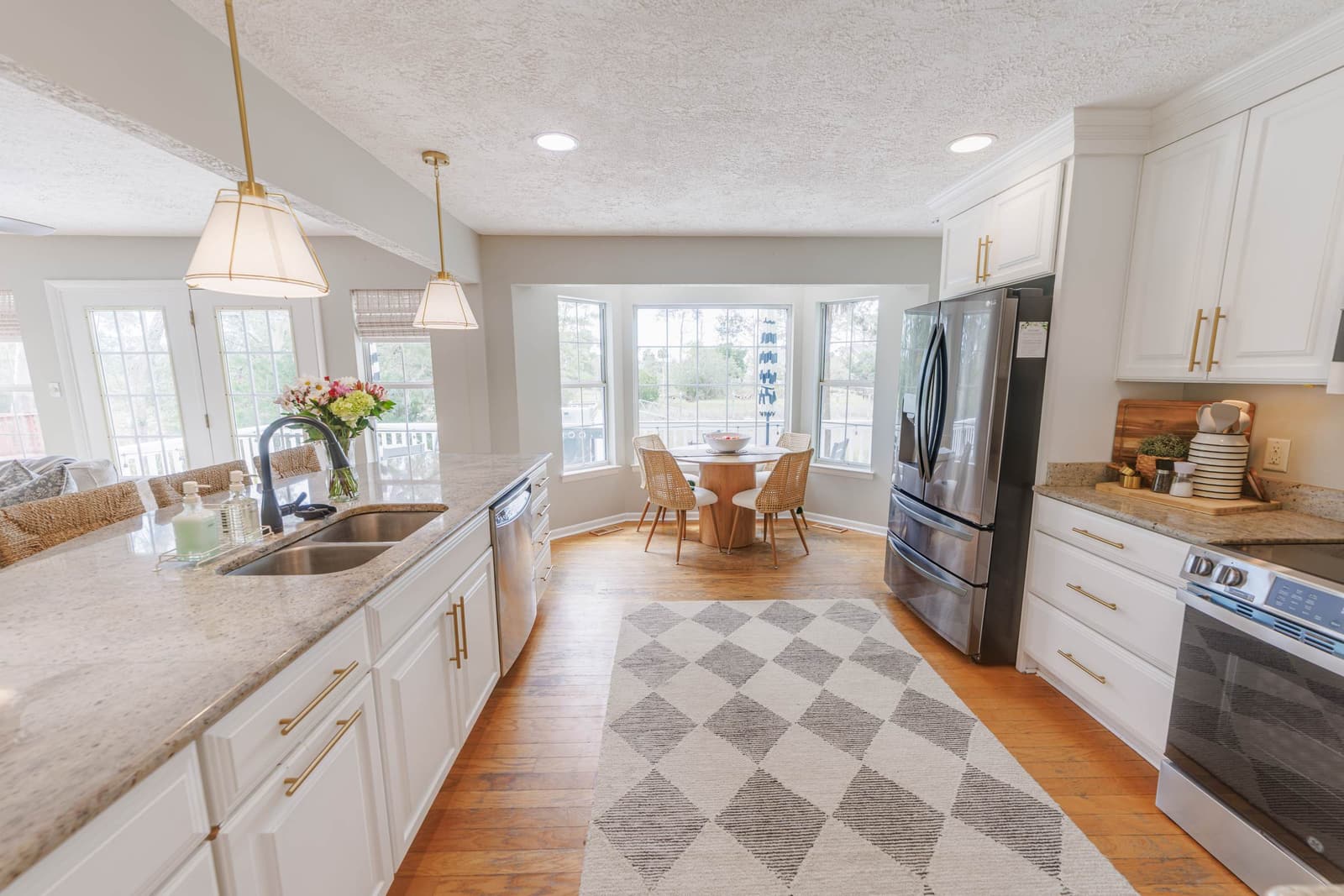 Kitchen and breakfast nook overlooking the back deck and dock
