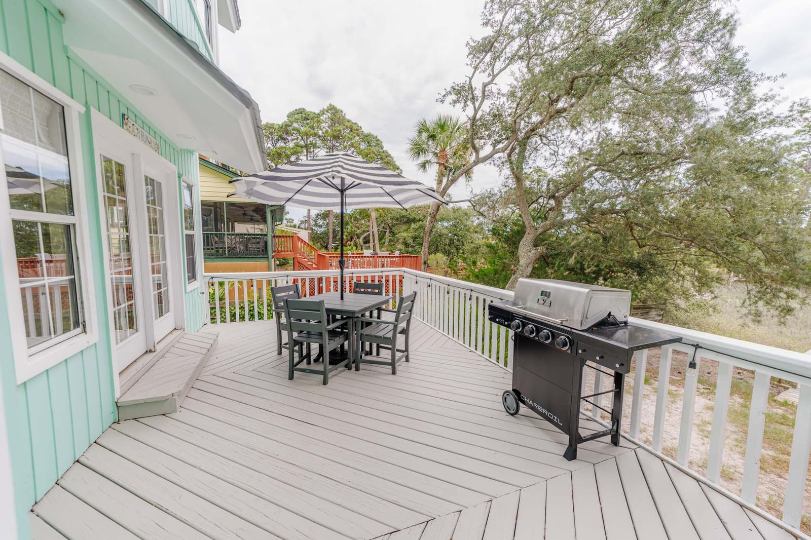 Back porch with dining sets and grill