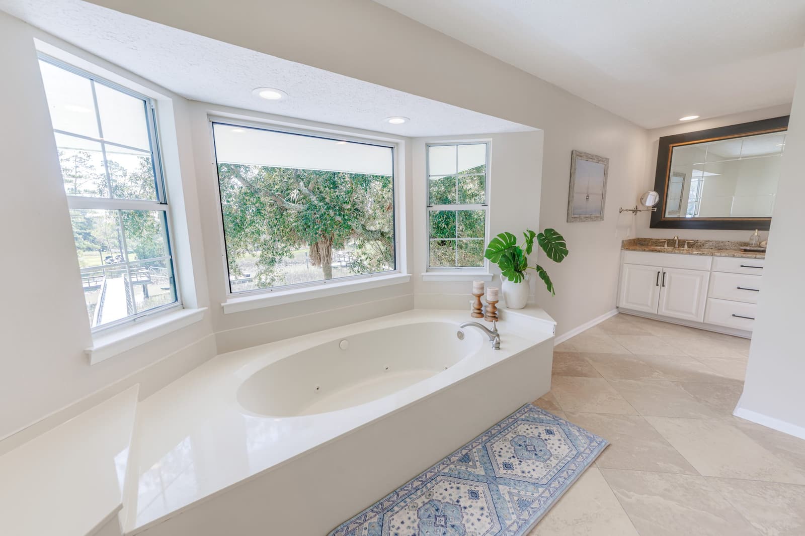 Primary bath with soaking tub overlooking the dock